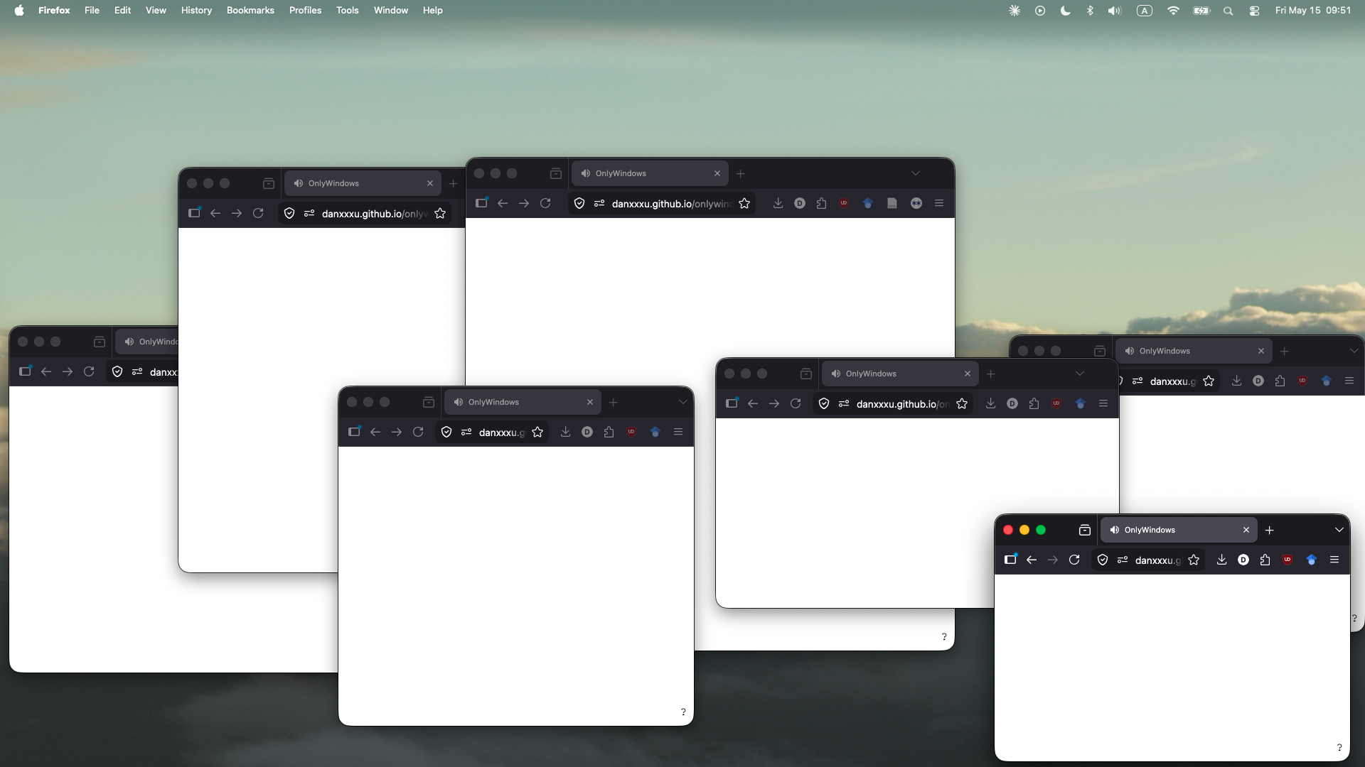 Multiple empty bowser windows open against a cloud macbook background.